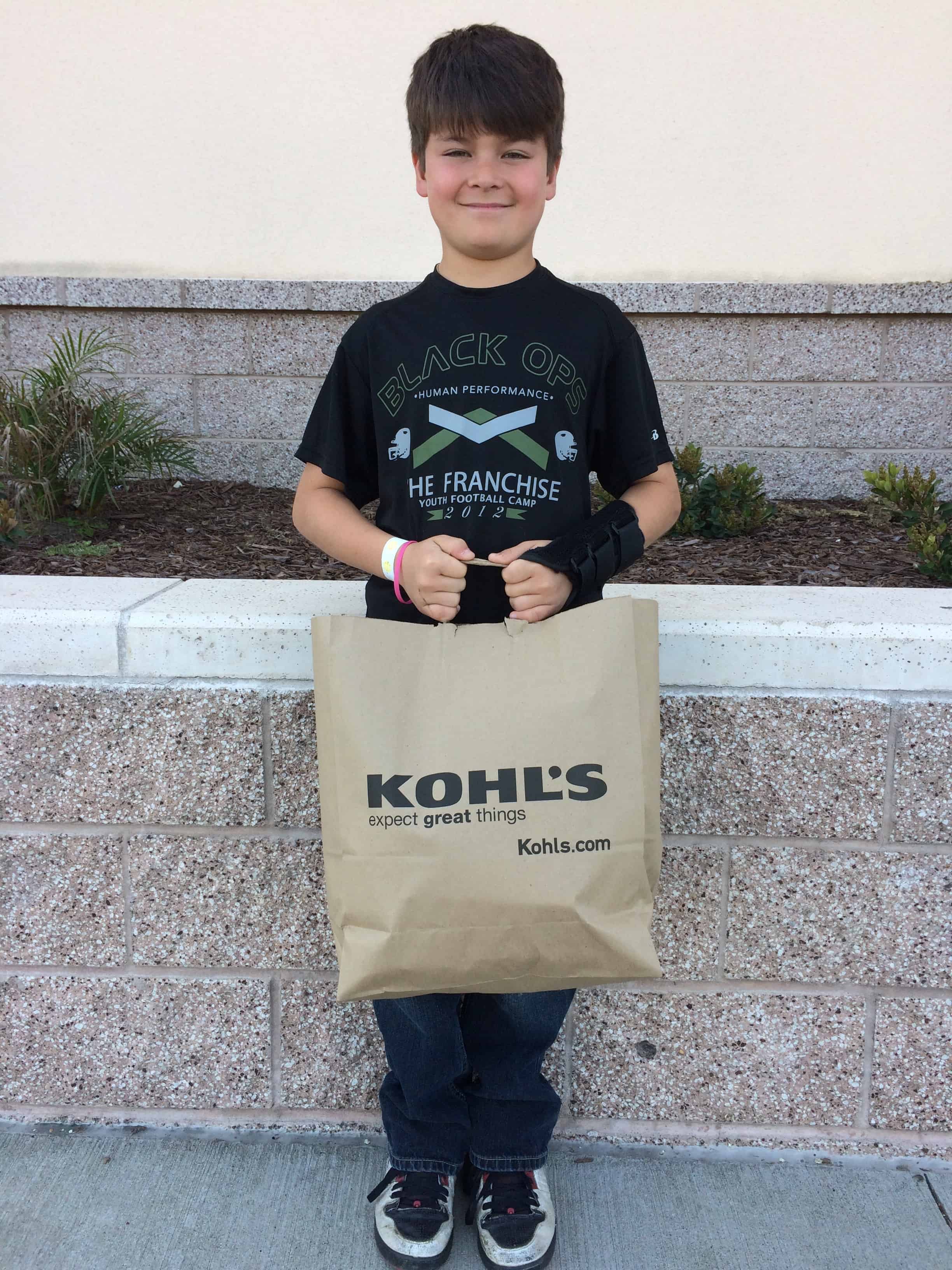 AssistanceLeague_boy with kohls shopping bag