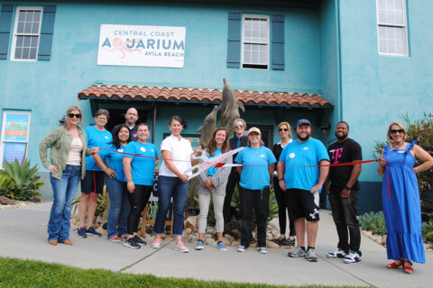 Picture of a group of people infront of the Central Coast Aquarium building for a ribbon cutting ceremony.