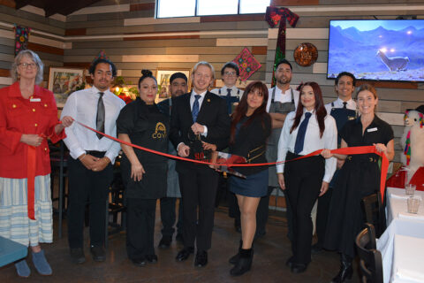 group photo of ribbon cutting at COYA Peruvian Food Restaurant