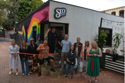 group ribbon cutting photo in front of SLO Cider in their downtown SLO Location